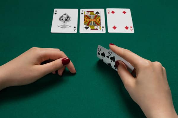 The dealer puts three cards face up on the board, known as the flop. After a round of betting, a fourth card (the turn) is dealt. Another round of betting occurs before the fifth and final card (the river) is dealt. The river is followed by one final round of betting.