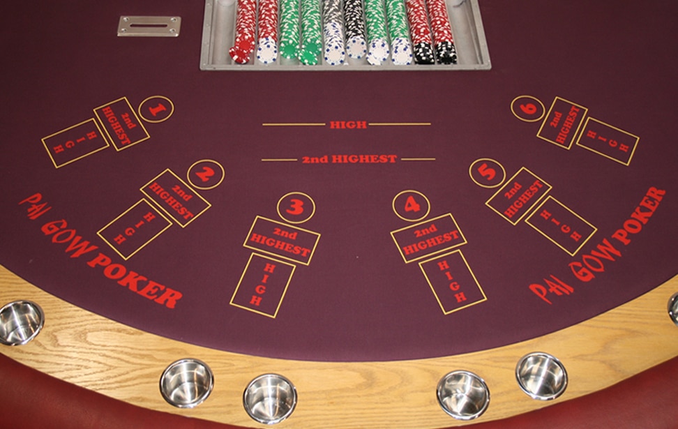 What's the significance of the Pai Gow Poker table layout?